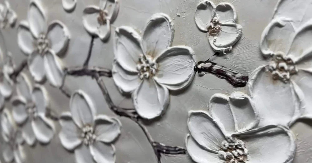 textured white blossom branch wall art with raised floral details