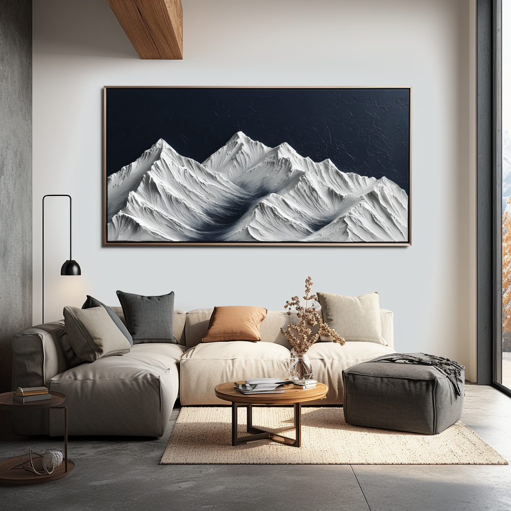 Textured snow-covered mountain landscape with white peaks and dark blue sky.