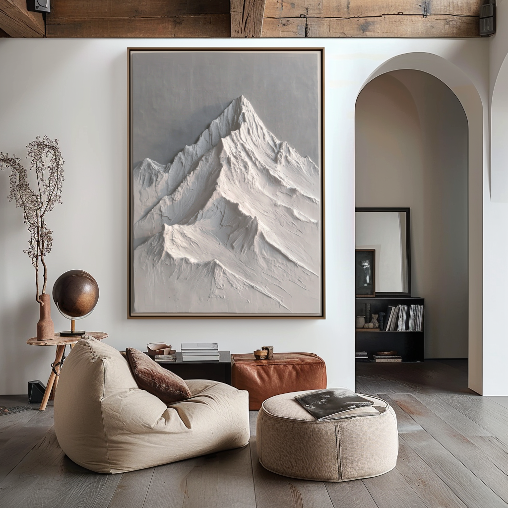 Textured snow-capped mountain landscape in white and gray tones with raised ridges.