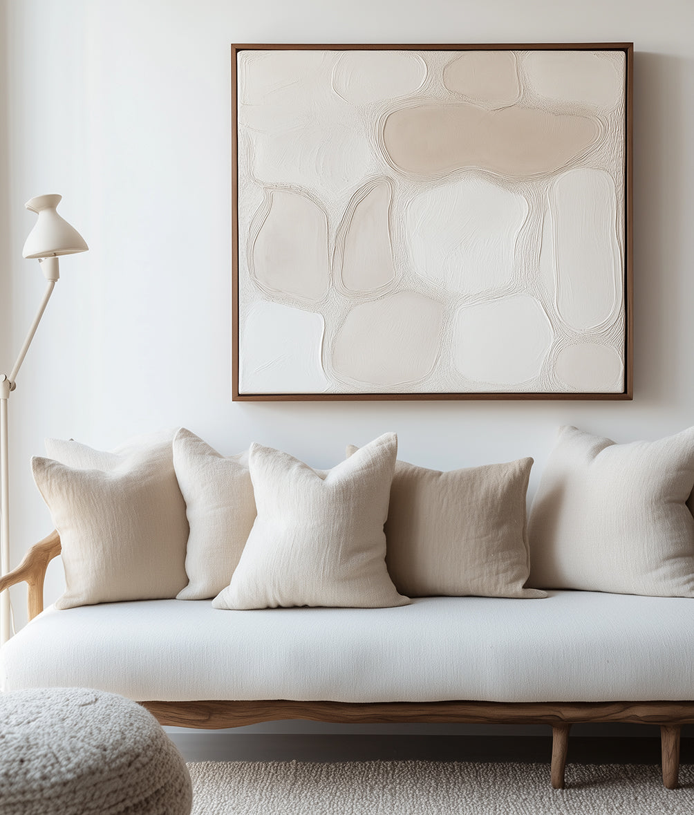 Minimalist abstract impasto art in soft beige and white tones with textured, flowing shapes creating a serene and elegant design.
