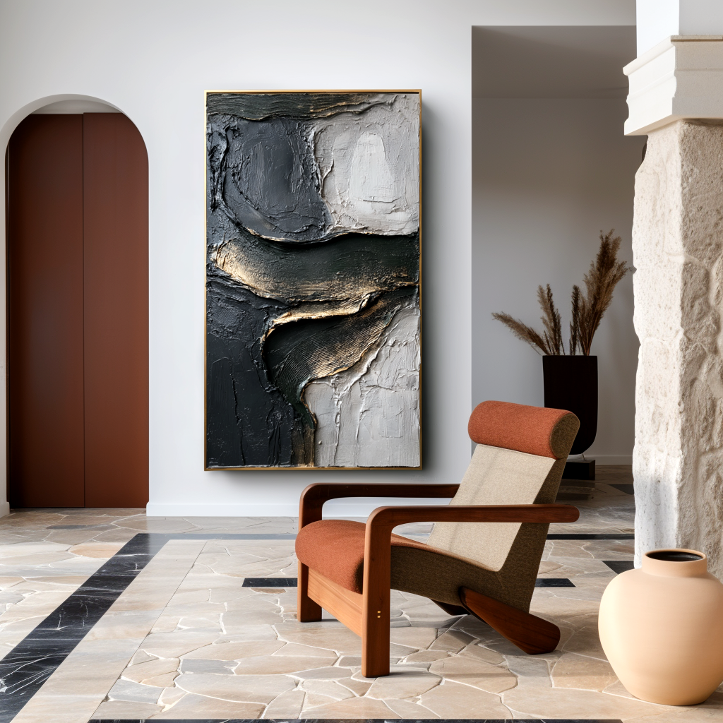 textured black, white, and gold abstract wall art with raised lines and curves