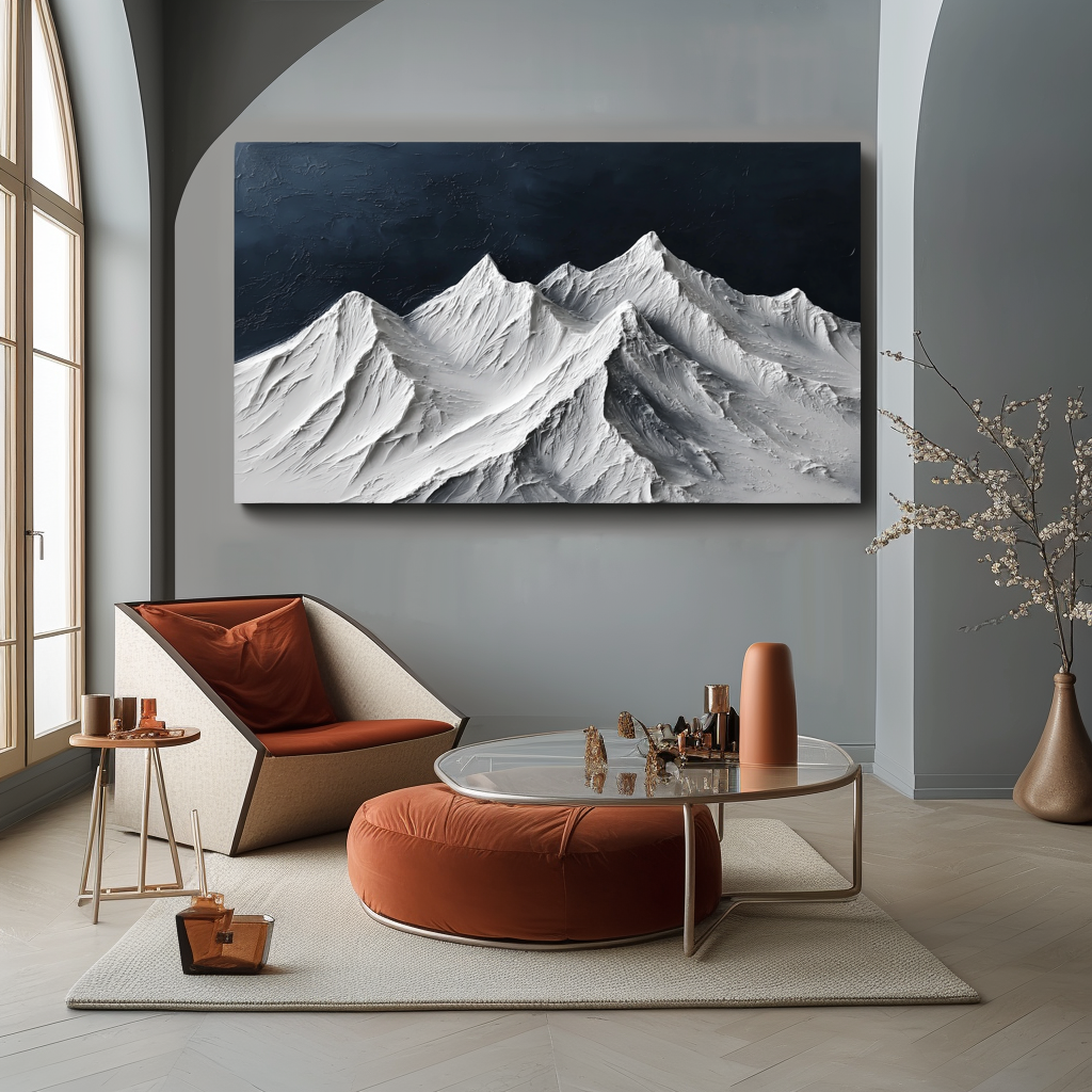Textured snow-covered mountain range with white peaks and dark blue sky.