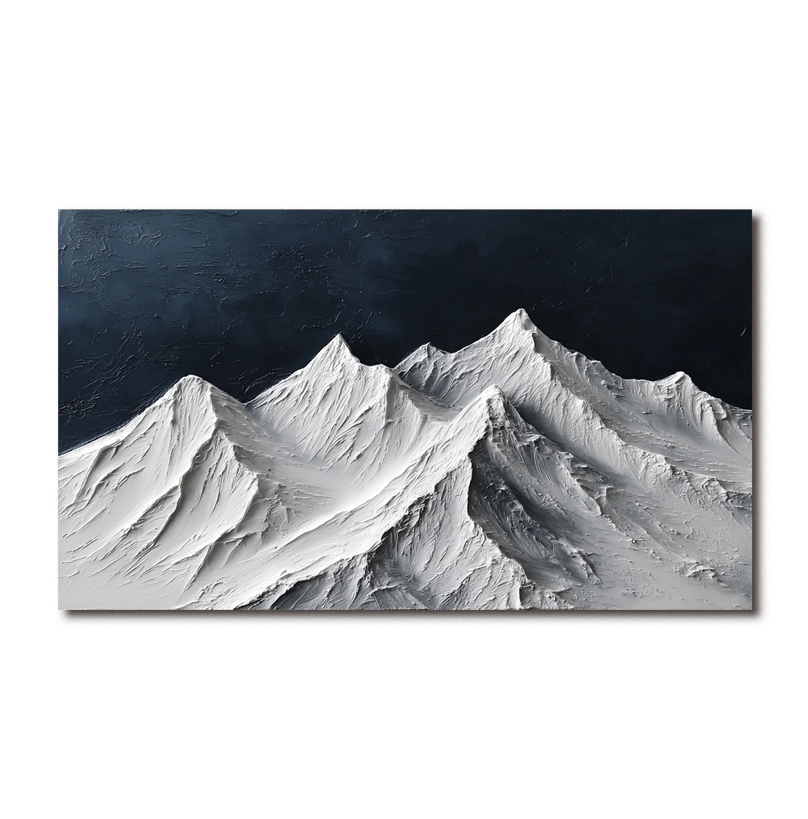 Textured snow-covered mountain range with white peaks and dark blue sky.