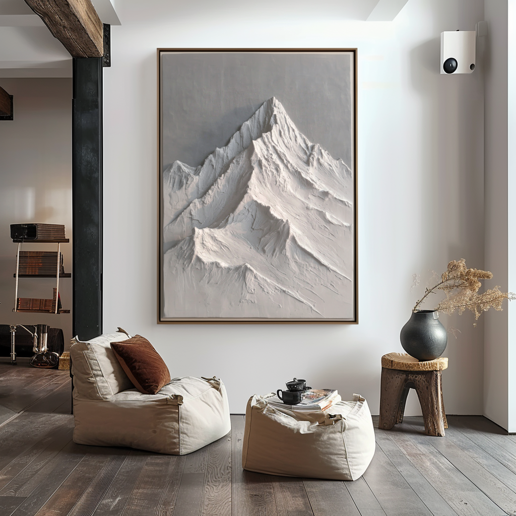 Textured snow-capped mountain landscape in white and gray tones with raised ridges.