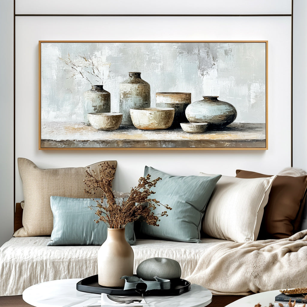 Still life painting of ceramic vases and bowls in neutral tones with a touch of dried grass.